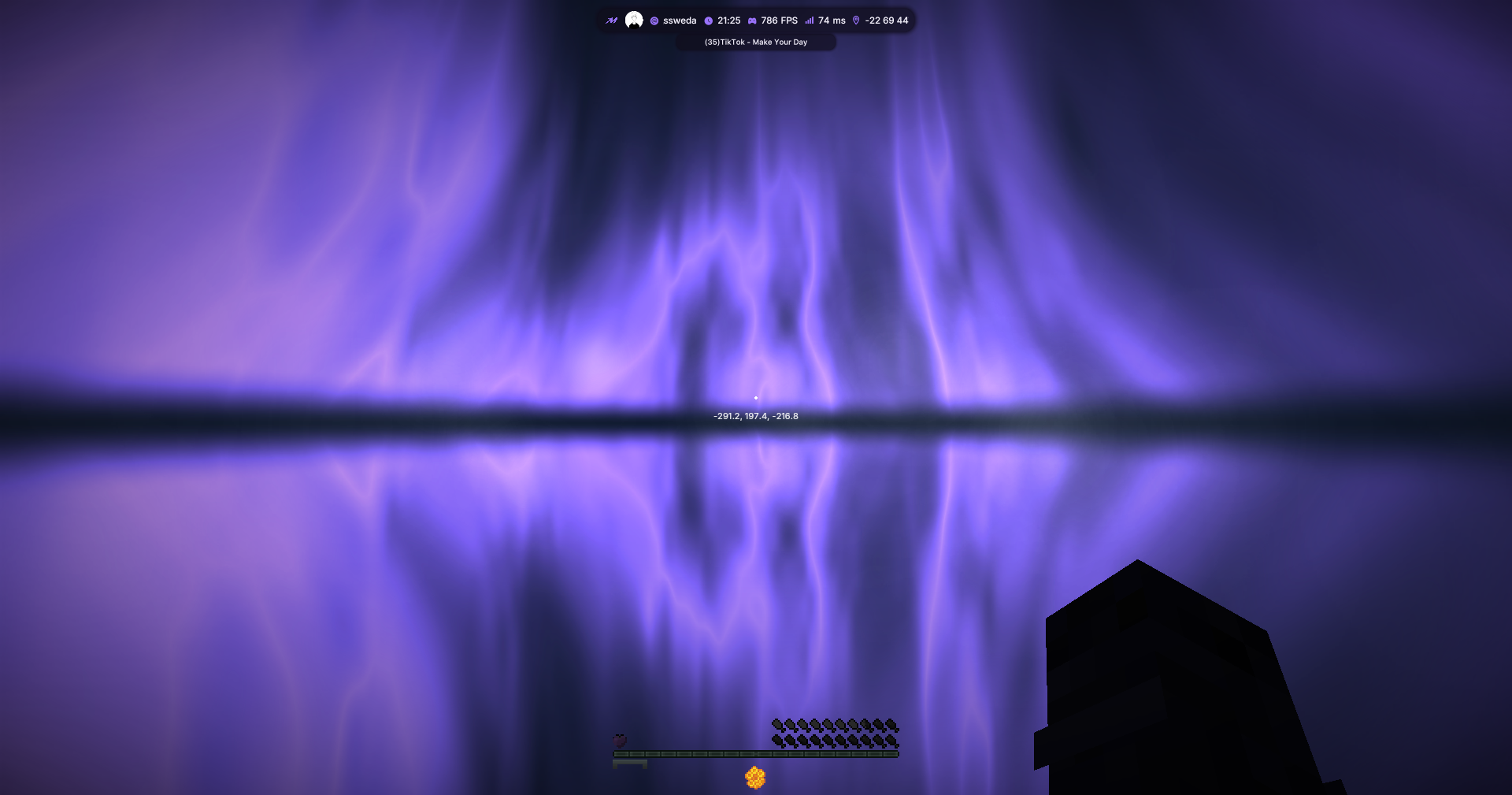 Purple aurora reflected across the horizon